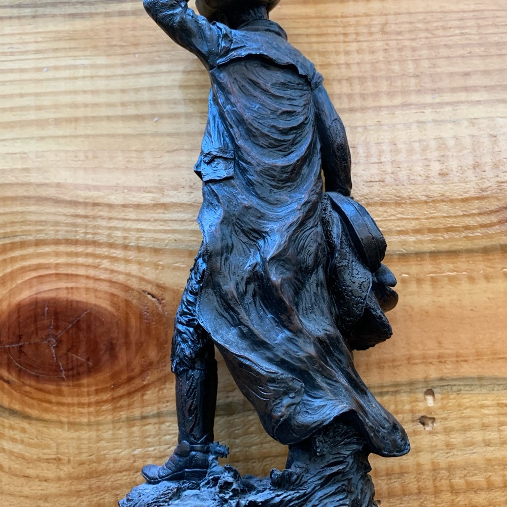Western cowboy holding horse saddle statue - Picture 3 of 4